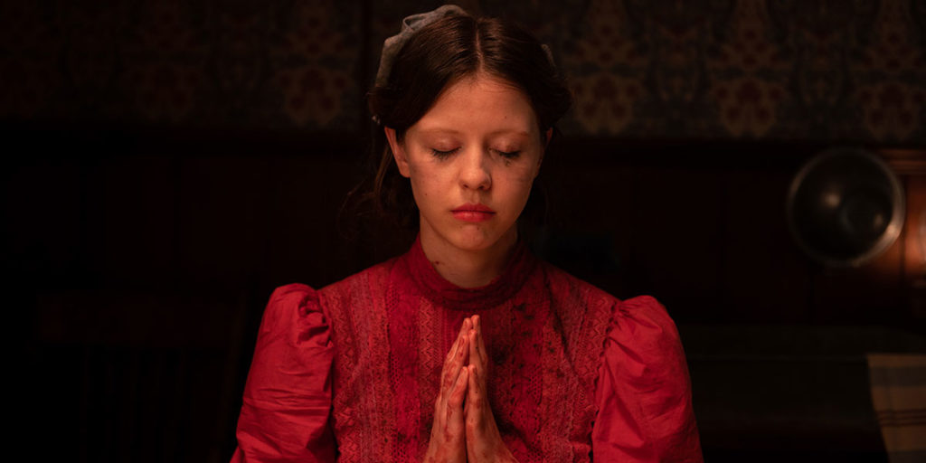Pearl movie with girl praying.