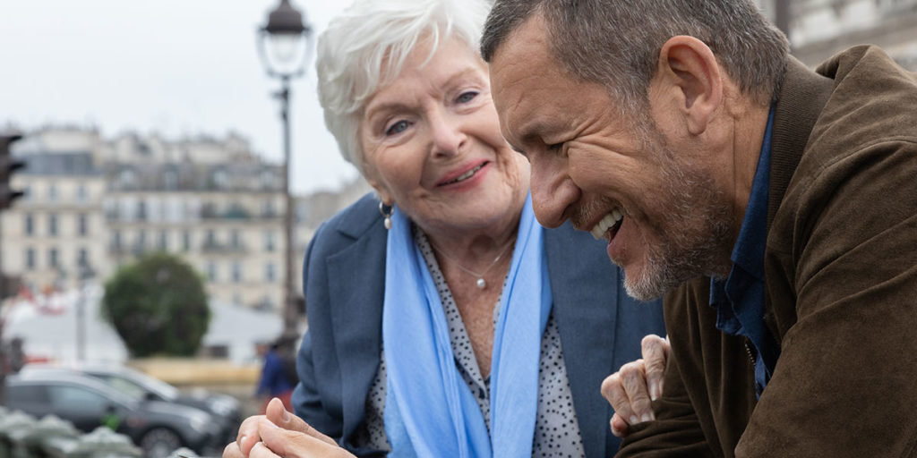 Still from the film Driving Madeleine of a elderly lady talking to a young taxi cab drver