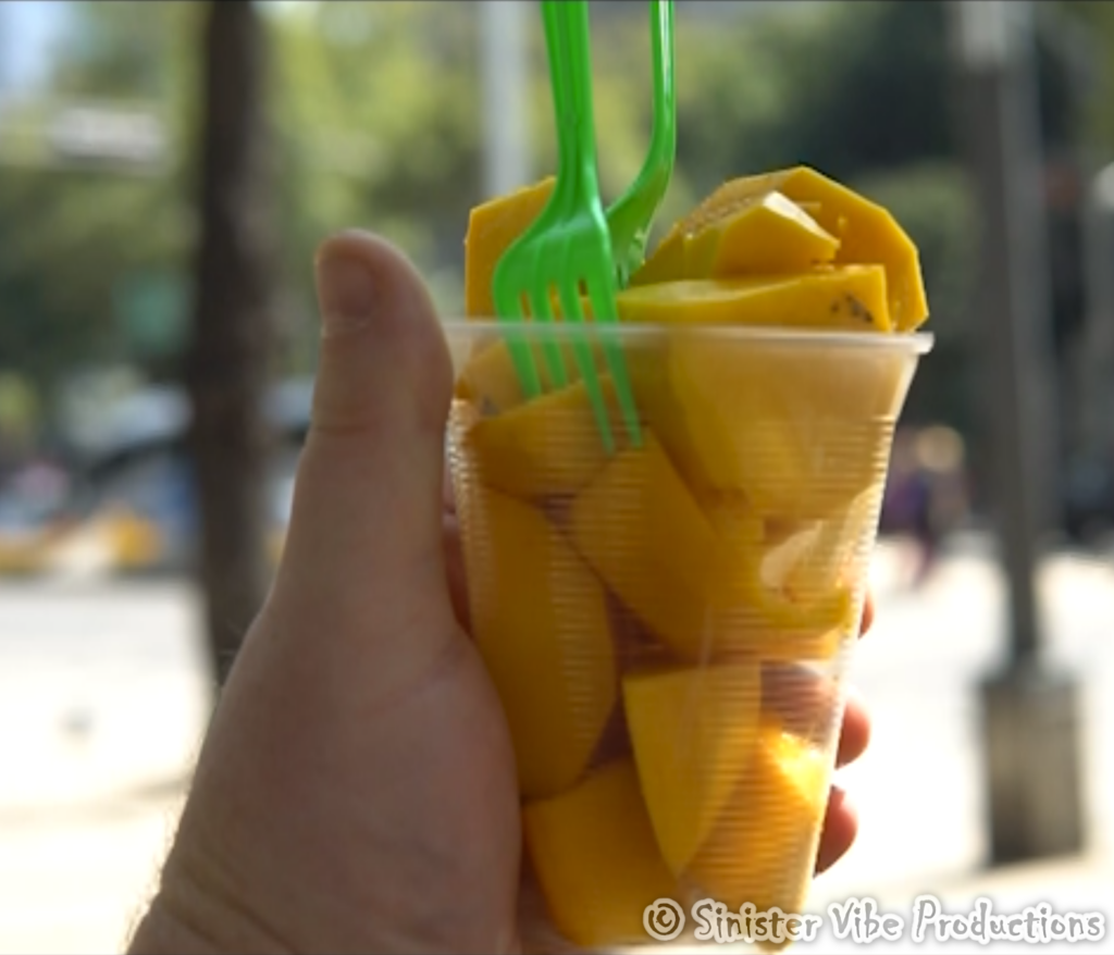 hand-holding-fresh-mangos