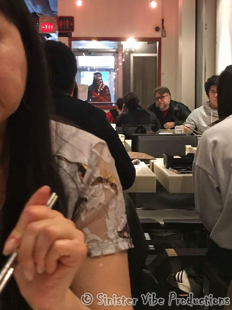Photo of Guillermo Del Toro eating lunch