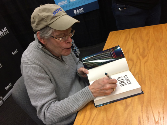 Photo of Stephen King signing on of this books